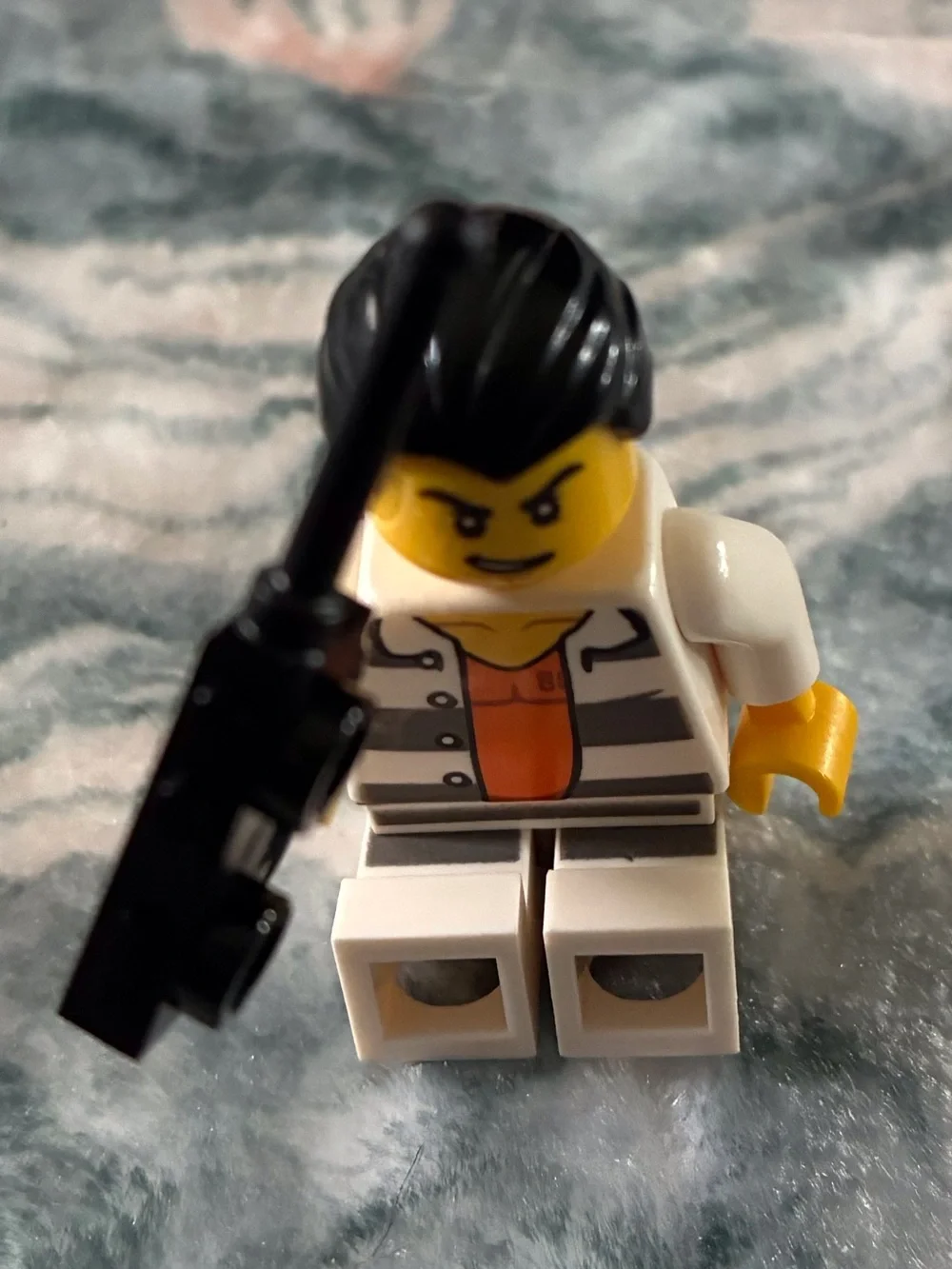 Lego Yellow Minifigure with Black Hair and White/Gray Striped Prison Outfit